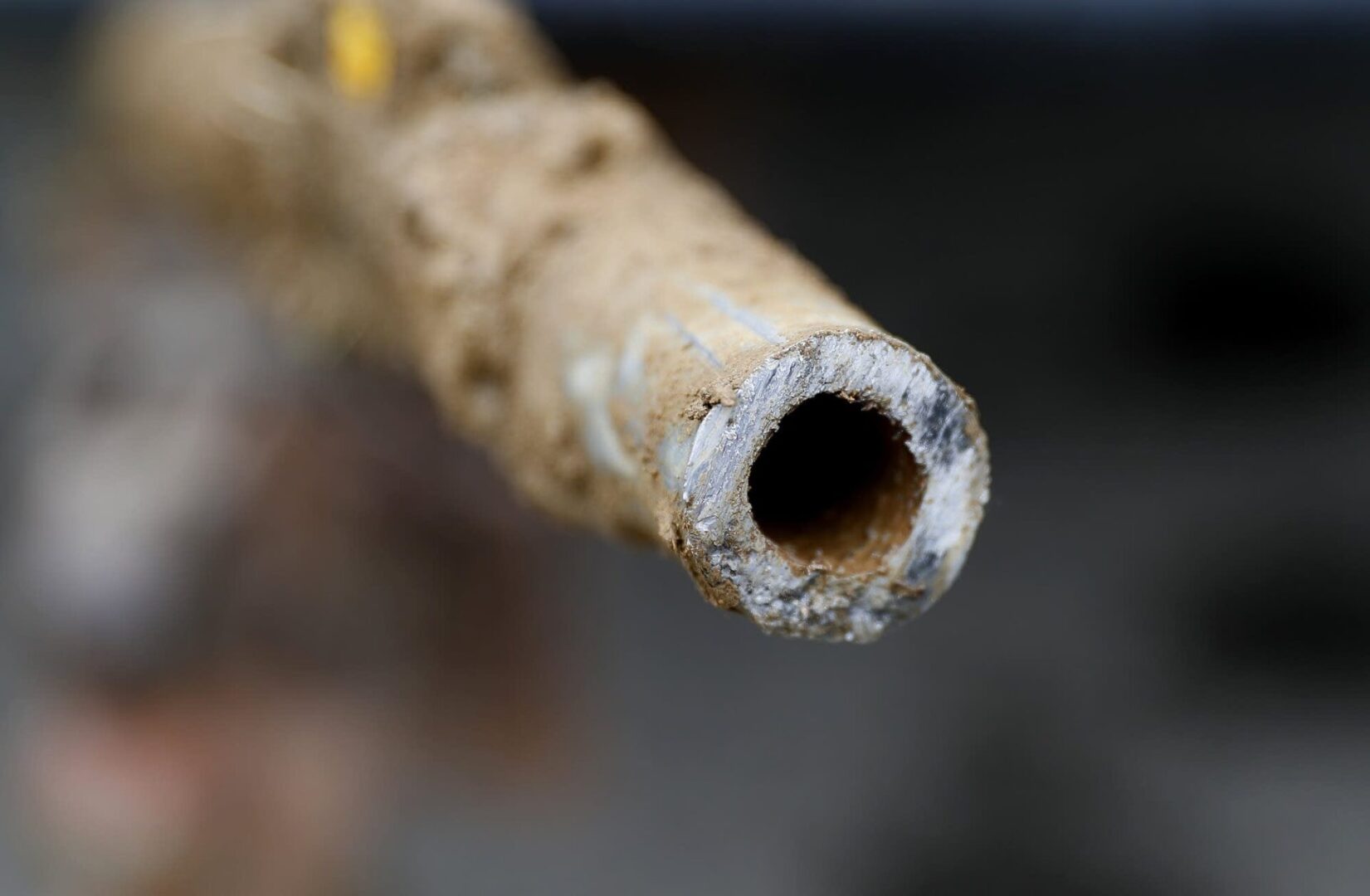A close up of the end of an old pipe